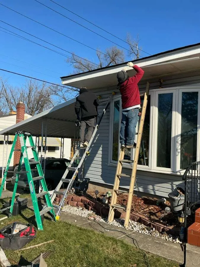 Restoration crew performing exterior repair in Palm River-Clair Mel